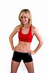 Beautiful blond young woman with an ideal waist is wearing fitness clothing.  Shot on a white background.