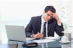 Focused businessman working in his office