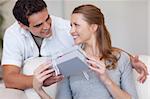 Young woman smiling happily about the present she just got from her boyfriend