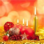 christmas red candles on golden bokeh lights background