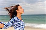 freedom: woman enjoying the wind and the sea
