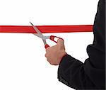 business man cutting a red ribbon with  scissors