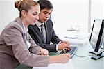 Young business people working with a computer in an office