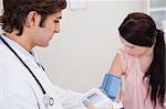 Young female having her blood pressure checked