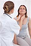 Doctor examining patients painful throat