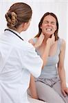 Doctor examining patients painful jaw