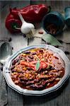 Chili con carne plate. Mexican traditional dish in rustic setting