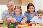 Charming family cooking together in a kitchen