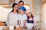 Family baking together in a kitchen