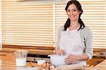 Beautiful woman baking in her kitchen