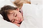 Calm children sleeping in a bedroom