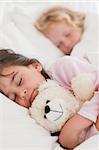 Portrait of calm children sleeping in a bedroom