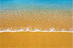 Surf on a tropical beach - summer background