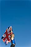 Male athlete holding up British flag