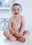 Infant playing with food, portrait