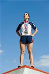 Female athlete standing on winner's podium