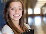 USA, Utah, Spanish Fork, Portrait of school girl (16-17) holding file in corridor