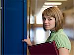 USA, Utah, Spanish Fork, Portrait of school girl (16-17) holding file by locker