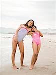 USA, California, Los Angeles, Portrait of two girls (6-11) on beach