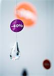-40% sign hanging on crystal pendant