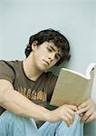 Young man reading book