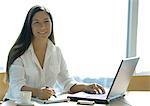 Businesswoman working with laptop