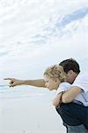 Boy and father on beach