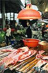 Cut up fish in market stall