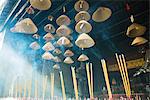 Incense burning in Chinese temple, low angle view