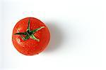Tomato with droplets of water, close-up, viewed from directly above