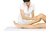 Woman performing leg massage