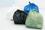 Assortment of garbage bags, all full