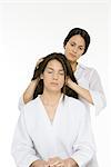 Woman receiving head massage, eyes closed