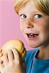 Boy with ham and cheese sandwich