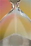 Sand passing through hourglass, close-up