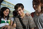 Teenage friends laughing together