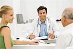 Doctor with senior patient providing medical consultation