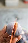 Cutting a ripe fig