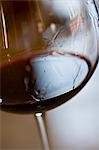 Tears of wine on glass of red wine