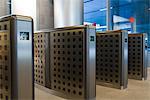 Turnstiles in office building lobby