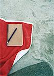 Notebook on beach towel