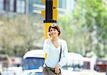 Young woman talking on cell phone in urban setting