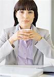 Career woman at desk, portrait