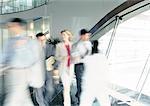 People walking inside office building, blurred