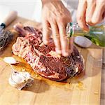 Close-up of ribeye steak being prepared with oil