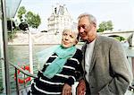 France, Paris, mature man and woman on a boat in the River Seine