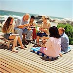 Multi-generation family eating outside