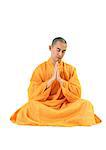 Buddhist monk sitting, meditating with hands together, front view