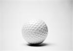 Golf ball, close-up, b&w.