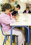 Children in classroom, side view